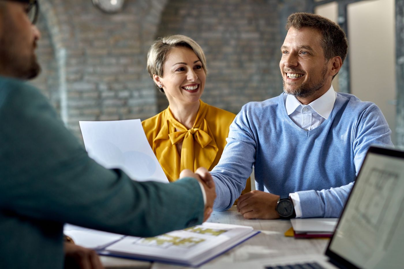 Client working with a mortgage agent to review financing options